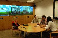 Images of the unknown people in the Grid Room within the CSEC building.